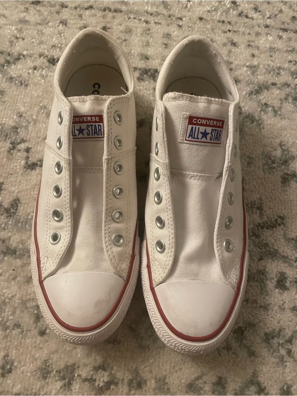 Converse Women’s White Slip-On All Star Sneakers with Red Trim